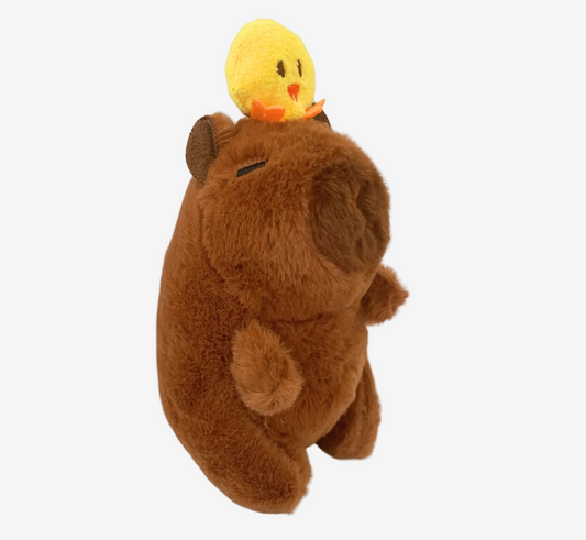 Plush toy bear with a small yellow chick on its back against a white background