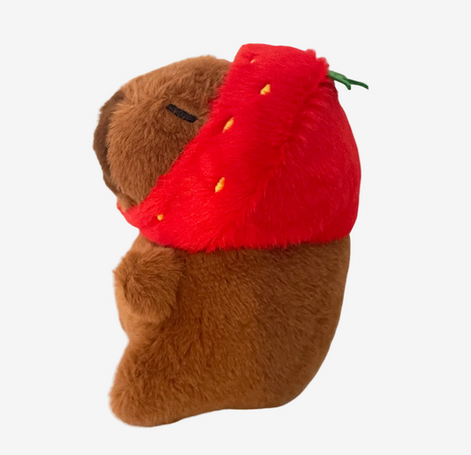 Plush capybara with a red strawberry on a white background