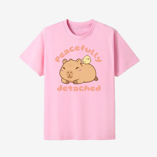 Pink t-shirt with a cartoon capybara and chick design and text on a white background