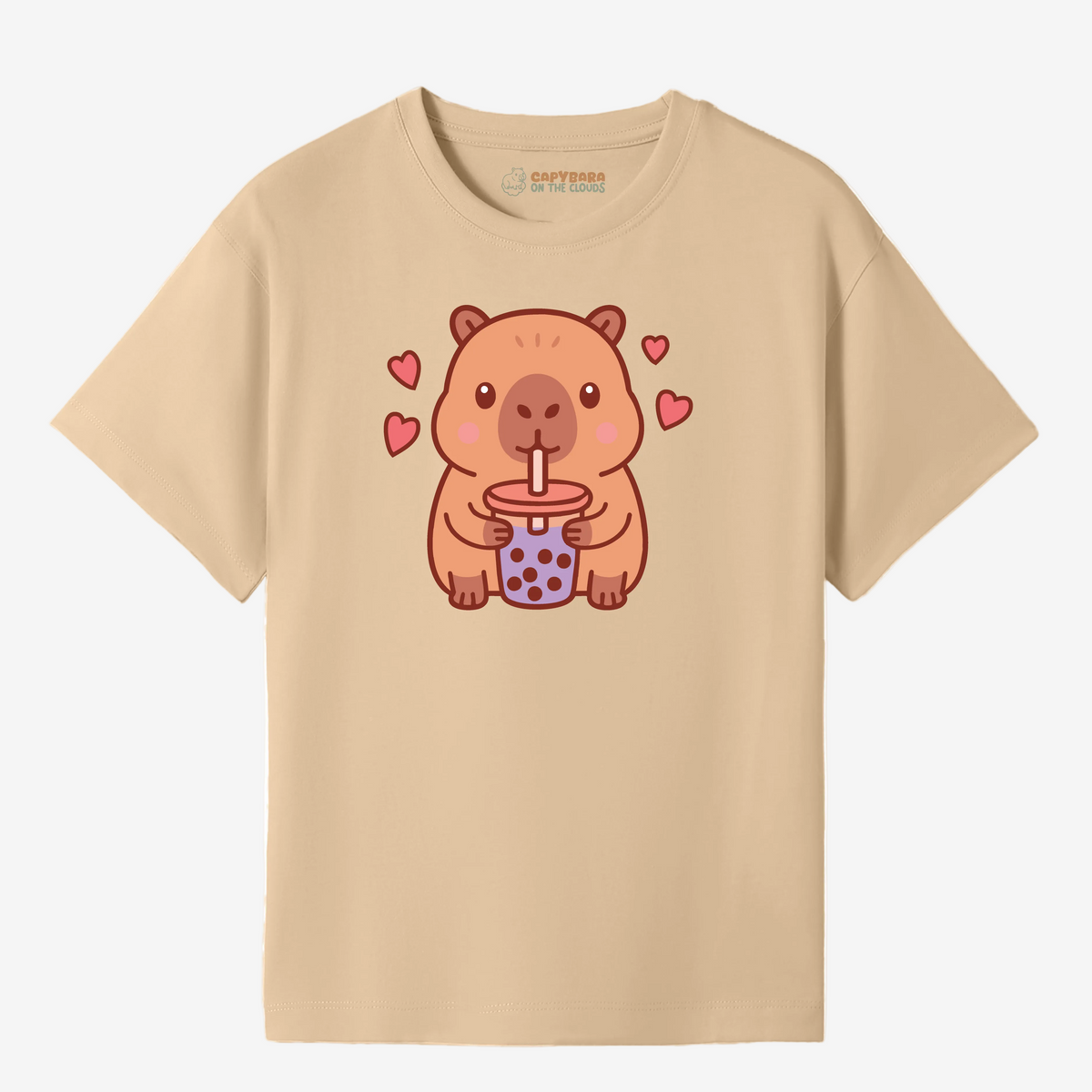 Beige t-shirt with a cartoon capybara drinking bubble tea design on a white background