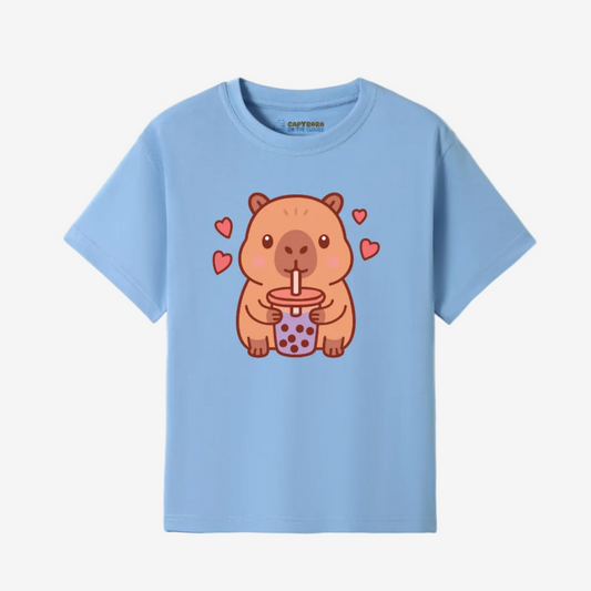 Light blue t-shirt with a cartoon capybara holding a drink and hearts on a white background