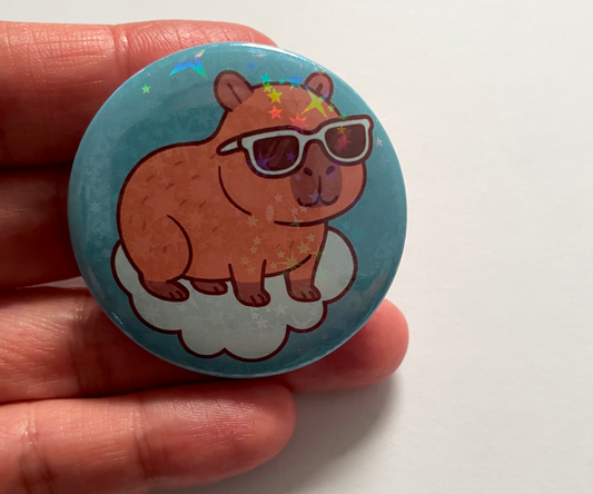 Button badge with a capybara wearing sunglasses