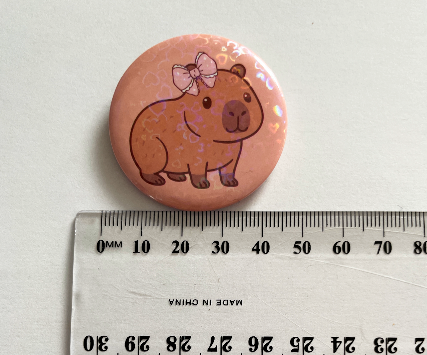 Capybara Button Pin 44mm, Cute Bow Capybara, Holographic Heart Kawaii Animal Badge, Backpack Accessory Pin