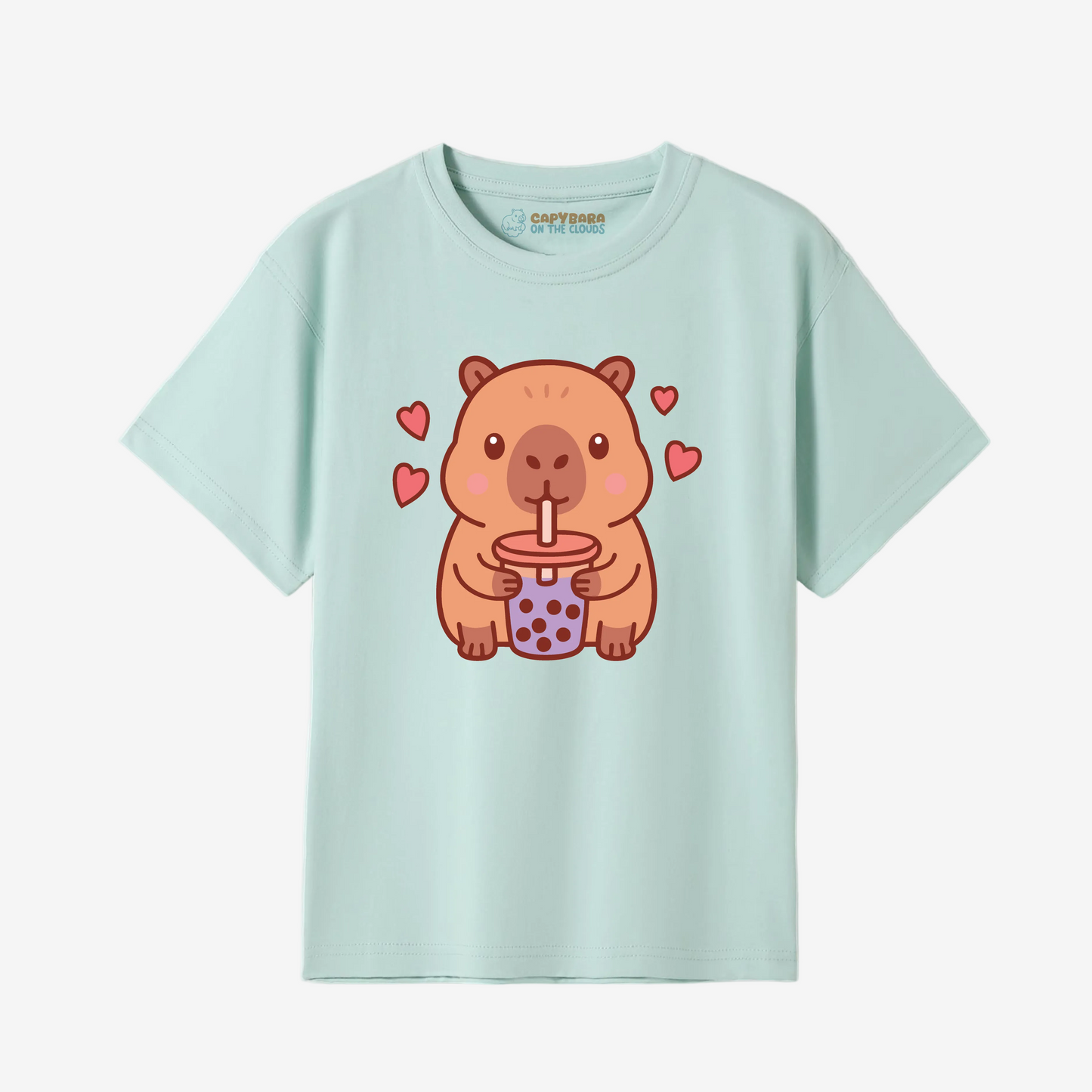 Light blue t-shirt with a cartoon capybara design holding a cup on a white background