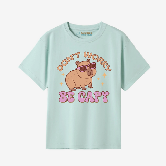 Light blue t-shirt with a cartoon capybara and text on a white background