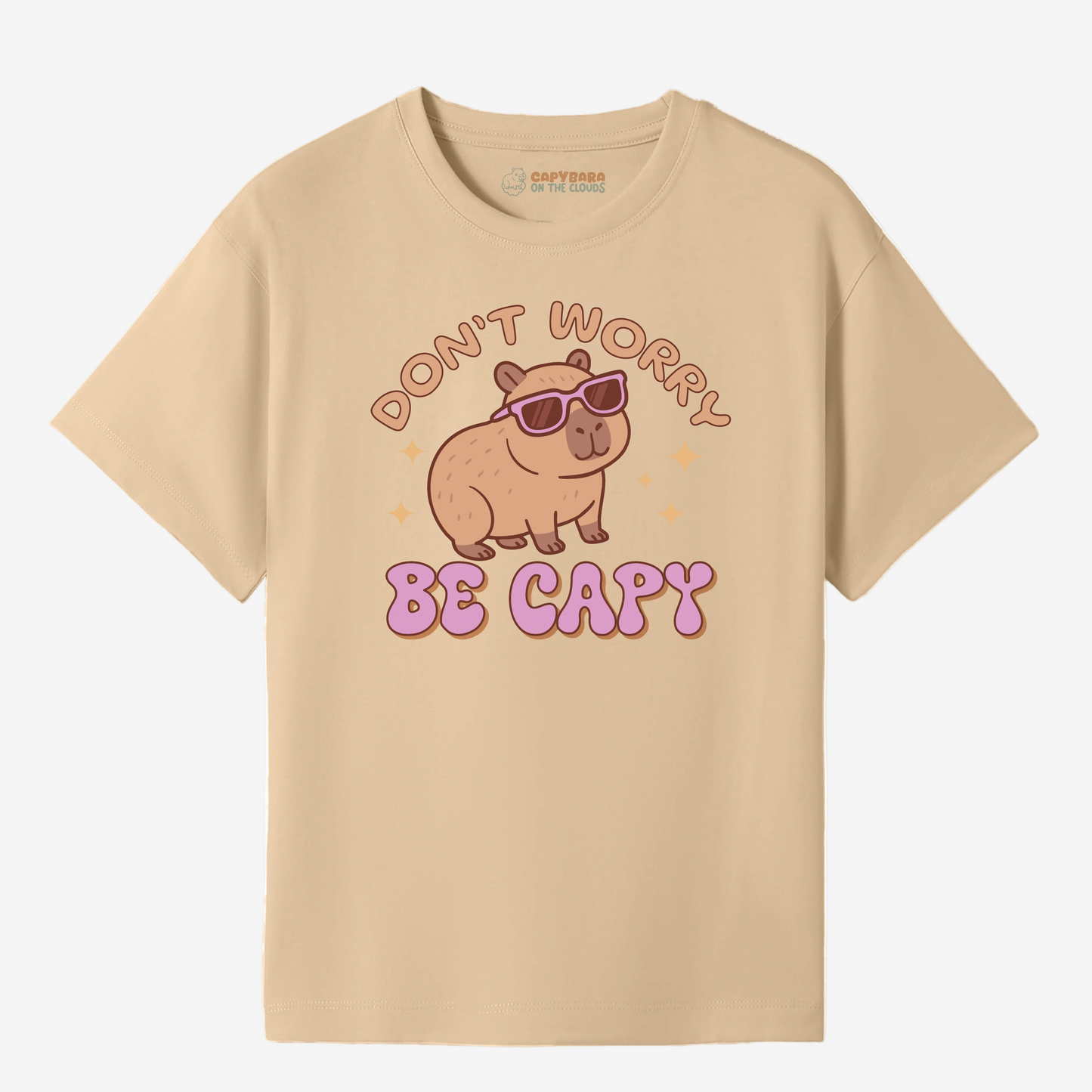 Beige t-shirt with a capybara graphic and text on a white background